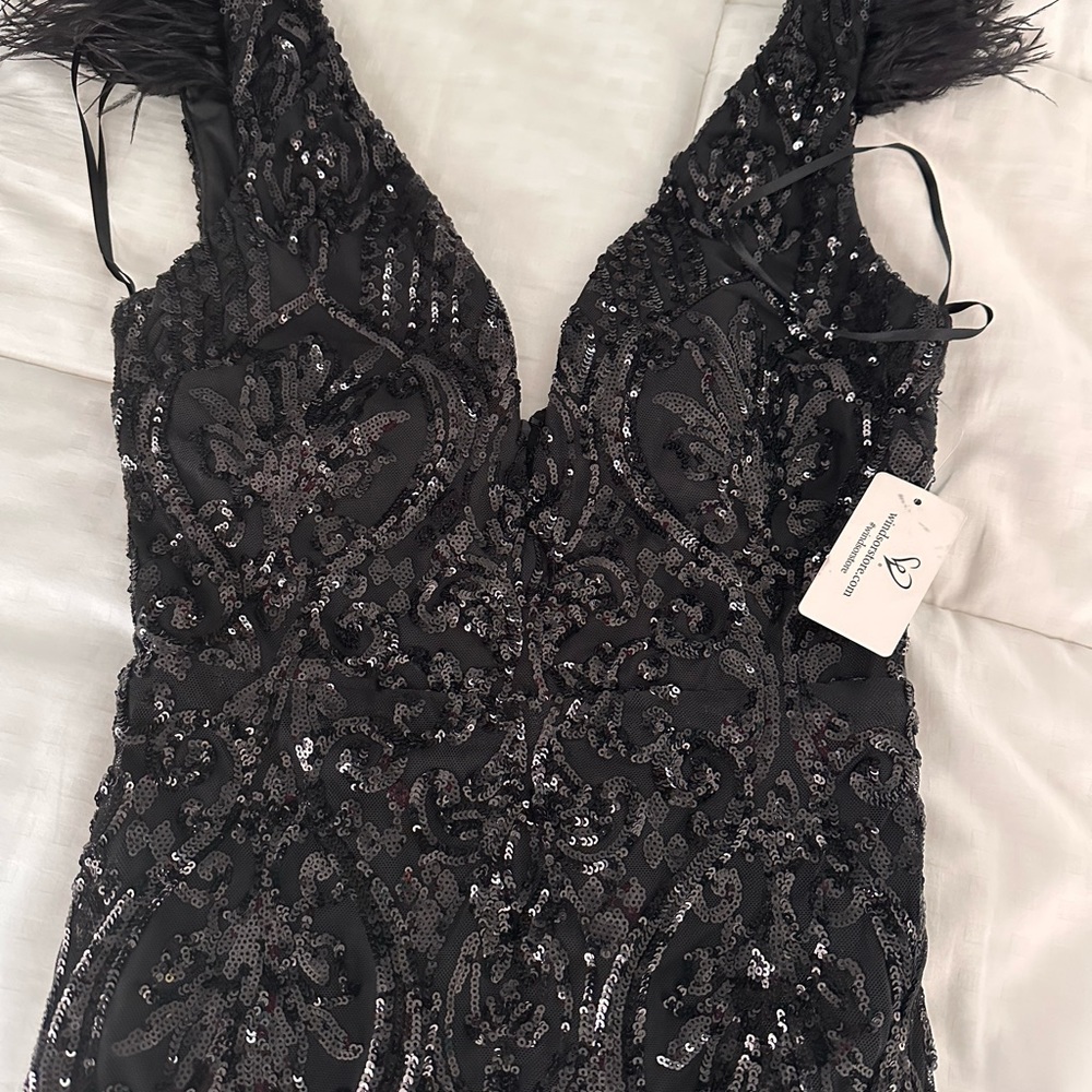 Elle formal sequin feather long dress- size medium 
Windsor 
NWT
